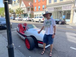 My dad checking out an unusual vehicle parked along the curb in Charleston, SC