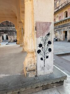 A detail of a column at the Amer Fort. Outdoor pavilions built to welcome guests and conduct business.